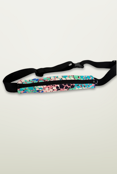 Multicolored waist bag with black strap on a light gray background
